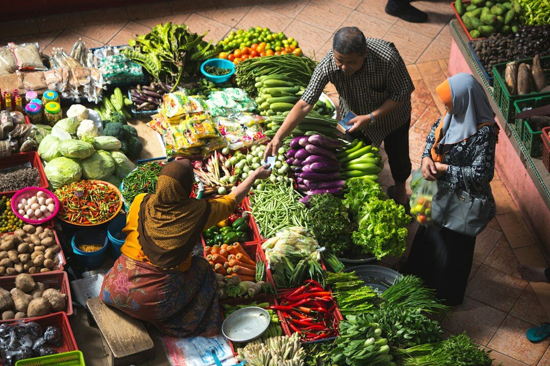Market vendor arranging fresh produce